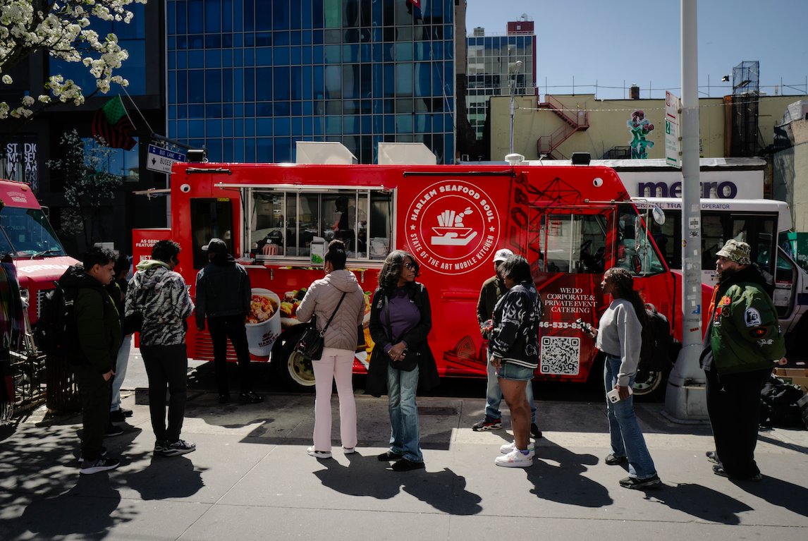 Harlem Seafood Soul food truck with people waiting in line